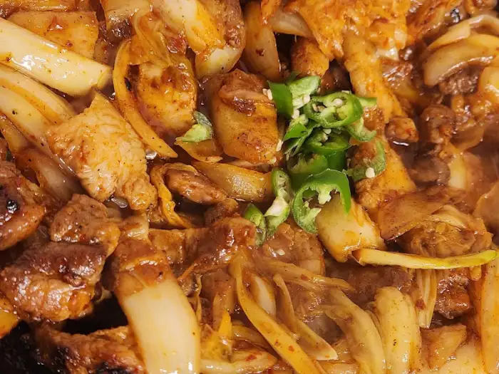 돼지김치구이의 근접샷, 고기와 김치의 조화가 돋보임
